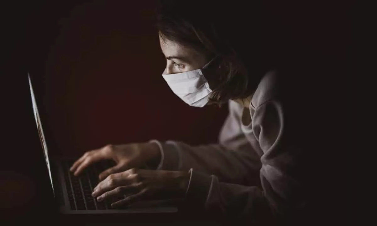 person browsing internet with a mask on