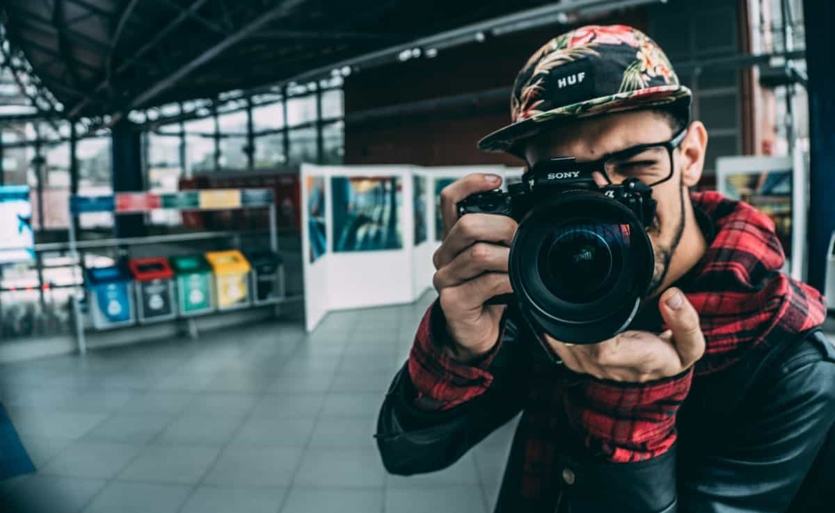 traveller holding a black camera