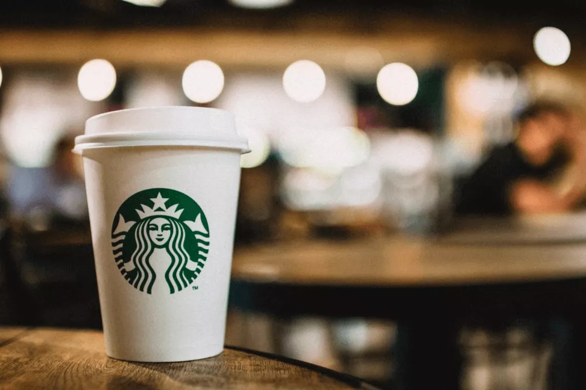 starbucks cup with its logo on a table