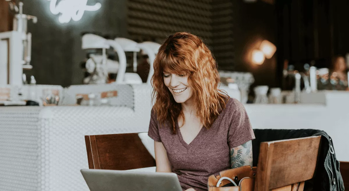 woman enjoys writing with laptop in conducive writing